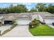 Charming home with well-maintained landscaping and an attached two-car garage at 8932 Village Green Blvd, Clermont, FL 34711