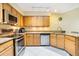 Well-equipped kitchen with stainless steel appliances, granite countertops, and ample cabinet space at 8932 Village Green Blvd, Clermont, FL 34711