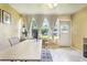 Bright home office with large windows, tile flooring, and a dedicated workspace at 8932 Village Green Blvd, Clermont, FL 34711