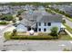 An aerial perspective captures the home's backyard with patio set, bordered by lush greenery and an iron fence at 9201 Smithies St, Orlando, FL 32827