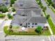Overhead view of a manicured backyard with a patio dining set and lush landscaping, perfect for outdoor relaxation at 9201 Smithies St, Orlando, FL 32827