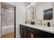Modern bathroom featuring a double vanity, marble countertops, and a stylish walk-in shower with marble tile at 9201 Smithies St, Orlando, FL 32827