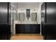 Stylish bathroom featuring a double vanity, marble countertops, and a glass-enclosed shower at 9201 Smithies St, Orlando, FL 32827