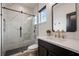 Modern bathroom featuring a glass shower with marble tile, sleek vanity, and contemporary fixtures at 9201 Smithies St, Orlando, FL 32827