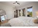 Bright bedroom with three windows, white walls, and a view of the modern outdoor space at 9201 Smithies St, Orlando, FL 32827
