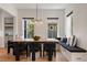 A dining area featuring a wood table, comfortable seating and natural light coming from the windows at 9201 Smithies St, Orlando, FL 32827