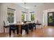 Bright dining room with built in bench seating and modern lighting at 9201 Smithies St, Orlando, FL 32827