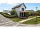 Beautiful two-story home featuring a cozy porch with outdoor seating at 9201 Smithies St, Orlando, FL 32827
