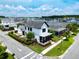 An exterior elevation shows a two-story house with a lush green yard, a front porch, and sidewalk at 9201 Smithies St, Orlando, FL 32827