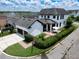 Expansive home with a two-car garage, outdoor patio, and lush landscaping at 9201 Smithies St, Orlando, FL 32827