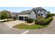 Contemporary home featuring a two-car garage, manicured landscaping, and outdoor living space at 9201 Smithies St, Orlando, FL 32827