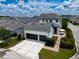 Spacious home with a two-car garage, inviting outdoor patio, and beautifully maintained landscaping at 9201 Smithies St, Orlando, FL 32827