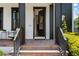 Open front door reveals a glimpse into the home's elegant interior at 9201 Smithies St, Orlando, FL 32827