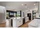 Modern kitchen with stainless steel appliances, center island and lots of open space to living area at 9201 Smithies St, Orlando, FL 32827