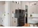 Gourmet kitchen featuring stainless steel appliances, custom cabinetry, and a center island with seating at 9201 Smithies St, Orlando, FL 32827