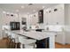 Modern kitchen featuring a large center island with white countertops and stainless steel appliances at 9201 Smithies St, Orlando, FL 32827