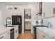 A well-appointed kitchen featuring stainless steel appliances and white subway tile backsplash at 9201 Smithies St, Orlando, FL 32827