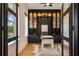 Stylish office with built-in shelving, chic decor, and ample natural light at 9201 Smithies St, Orlando, FL 32827