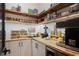 Custom pantry with a butcher block countertop, storage solutions, and room for appliances and accessories at 9201 Smithies St, Orlando, FL 32827