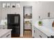 Walk-in pantry with custom shelving and a beautiful butcher block countertop for extra working space at 9201 Smithies St, Orlando, FL 32827