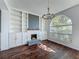 Bright living room featuring a fireplace, built-in shelving, and large window at 9454 Candice Ct, Orlando, FL 32832
