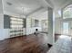 Bright living room features hardwood floors, a fireplace, built-in shelves and large windows at 9454 Candice Ct, Orlando, FL 32832