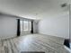 A living room with hardwood floors, a chandelier, and lots of natural light at 9454 Candice Ct, Orlando, FL 32832