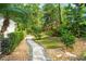 A landscaped walkway surrounded by rocks and hedges, perfect for an afternoon stroll in your new backyard at 9809 Covent Garden Dr # Drive, Orlando, FL 32827