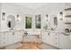 Bathroom featuring white marble tiling, dual sink vanities, and stand-alone tub at 9809 Covent Garden Dr # Drive, Orlando, FL 32827