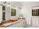 Elegant bathroom featuring double vanities, granite countertops, and stylish fixtures at 9809 Covent Garden Dr # Drive, Orlando, FL 32827