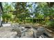 Relaxing fire pit area surrounded by lush landscaping and comfortable seating, perfect for outdoor gatherings at 9809 Covent Garden Dr # Drive, Orlando, FL 32827