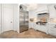 Bright kitchen with stainless steel appliances, white cabinets, and patterned backsplash at 9809 Covent Garden Dr # Drive, Orlando, FL 32827