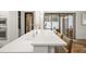 Kitchen featuring white countertops and cabinetry, with view of pool and patio at 9809 Covent Garden Dr # Drive, Orlando, FL 32827