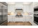 Modern kitchen with stainless steel appliances, custom backsplash, and ample counter space at 9809 Covent Garden Dr # Drive, Orlando, FL 32827