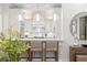 Kitchen featuring pendant lighting, modern bar stools, and sleek countertops at 9809 Covent Garden Dr # Drive, Orlando, FL 32827