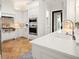 White kitchen featuring stainless steel appliances, countertops, and tiled backsplash at 9809 Covent Garden Dr # Drive, Orlando, FL 32827