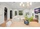 Bright living room with staircase, comfortable seating, and large windows at 9809 Covent Garden Dr # Drive, Orlando, FL 32827