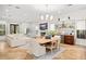 Open-concept living room with fireplace, dining area, and stylish decor at 9809 Covent Garden Dr # Drive, Orlando, FL 32827