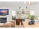 Living room featuring a fireplace, bar area, and neutral color palette at 9809 Covent Garden Dr # Drive, Orlando, FL 32827