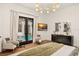 Bedroom with access to a pool, black dresser, and modern light fixture at 9809 Covent Garden Dr # Drive, Orlando, FL 32827