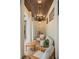 Charming covered patio with elegant chandelier, wood ceiling, and cozy seating at 9809 Covent Garden Dr # Drive, Orlando, FL 32827