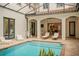 Private courtyard pool with a retractable enclosure for year-round enjoyment at 9809 Covent Garden Dr # Drive, Orlando, FL 32827