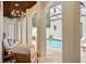 Covered outdoor seating area overlooking a serene pool in a private courtyard at 9809 Covent Garden Dr # Drive, Orlando, FL 32827