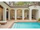 Picturesque courtyard pool with arches, perfect for outdoor relaxation and entertaining at 9809 Covent Garden Dr # Drive, Orlando, FL 32827