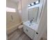 Bathroom with a single sink vanity with quartz countertop and tub with shower at 9982 Shadow Creek Dr, Orlando, FL 32832