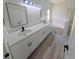 Bathroom featuring a double sink vanity, quartz countertop, and a separate tub and shower at 9982 Shadow Creek Dr, Orlando, FL 32832