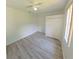 Bedroom featuring wood-look flooring, a ceiling fan, a closet, and a window at 9982 Shadow Creek Dr, Orlando, FL 32832