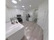 Bright kitchen featuring modern white cabinets, a quartz countertop, and stainless steel appliances at 9982 Shadow Creek Dr, Orlando, FL 32832