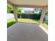 Spacious covered patio overlooking a well-kept backyard with lush greenery at 9982 Shadow Creek Dr, Orlando, FL 32832
