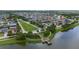 A high-angle aerial view showcasing the community and its amenities with the property highlighted in red at 1951 Betsy Ross Ln, St Cloud, FL 34769